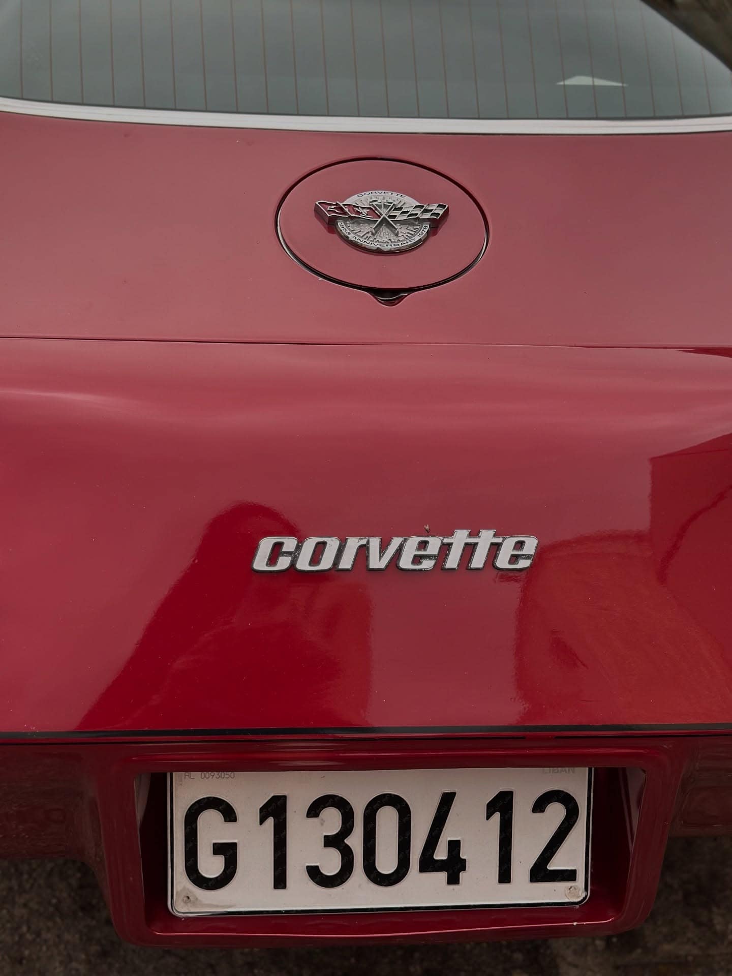A red Corvette badge and number plate