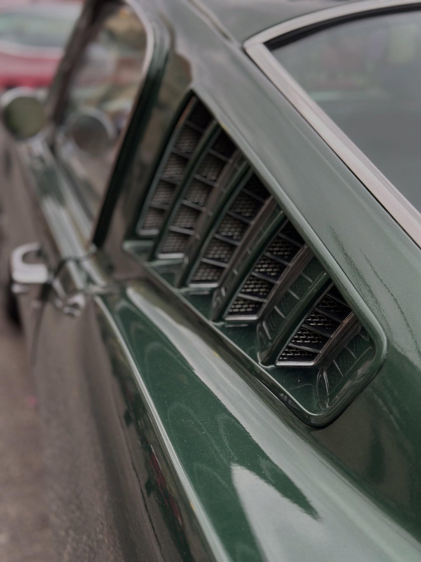Louvred vents on a green sports car