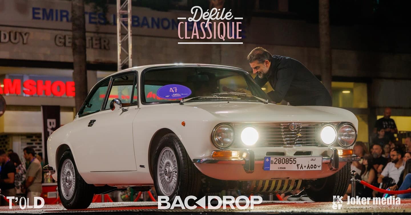A white 1974 Alfa Romeo GTV 2000 on the stage