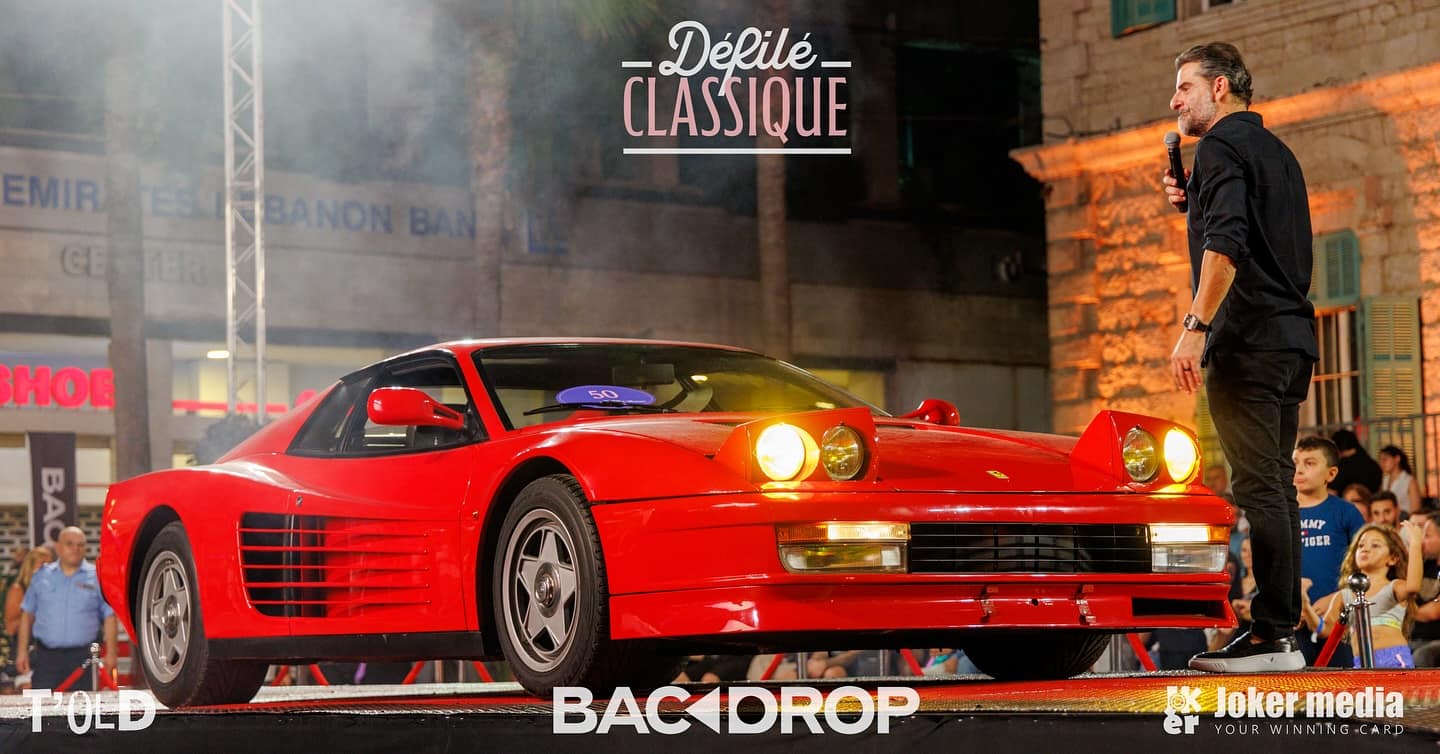 A red 1990 Ferrari Testarossa on the stage