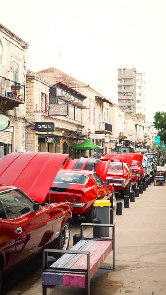 A line of red classics parked along the souk