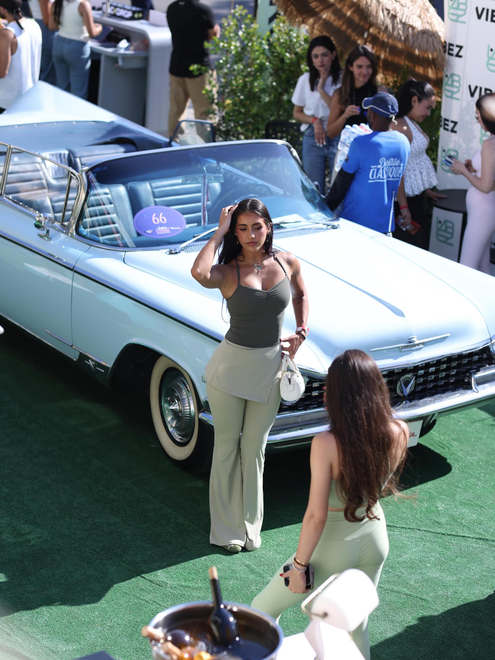 A white classic convertible at a Backdrop event