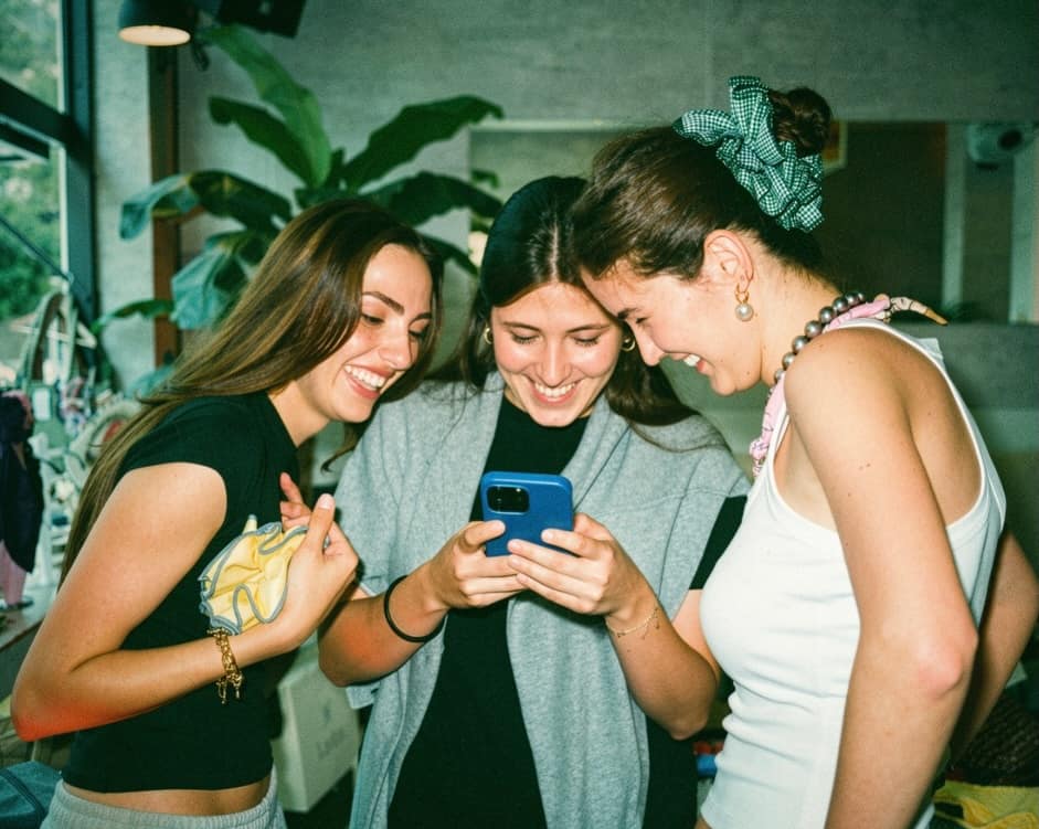 Three friends laughing at the Vas-y Street Edit